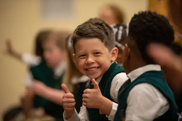 preK student giving thumbs up