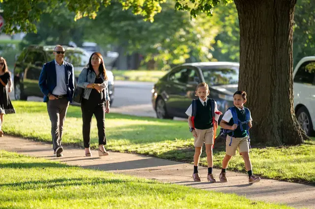 Family walking in Brookside Campus in the morning