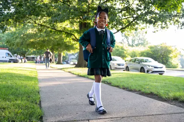 Girl walking into school
