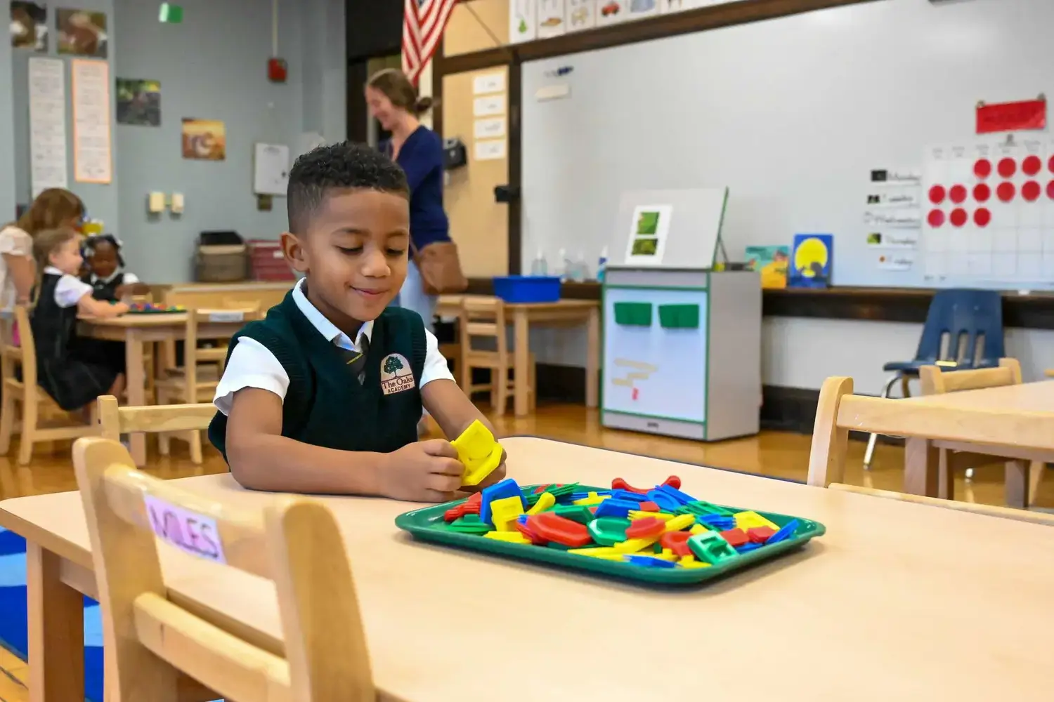 Pre-K student takes part in an activity centre task.